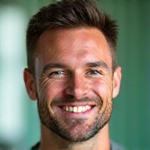 Portrait of Mark Jensen, a fit man in his late 30s.